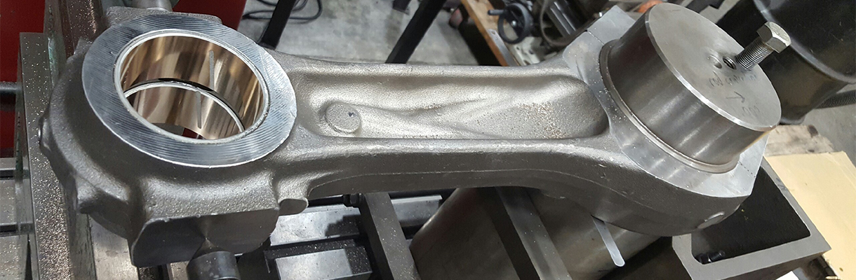 A refurbished connecting rod by Rutt's Machine Shop, Inc.